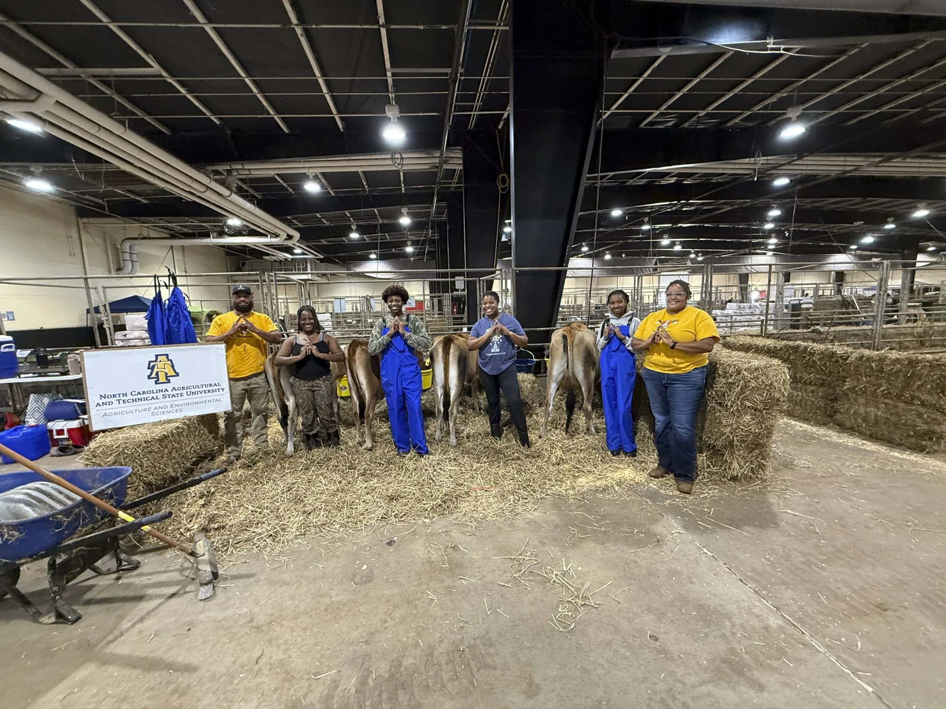 From left: Corey Burgess, Alysse Givan, Ethan Humphrey, Ericka Pearsall, Alyssa Dunn and Lauren Mayo, Ph.D., N.C. A&T's show team at the 2025 N.C. State Fair.